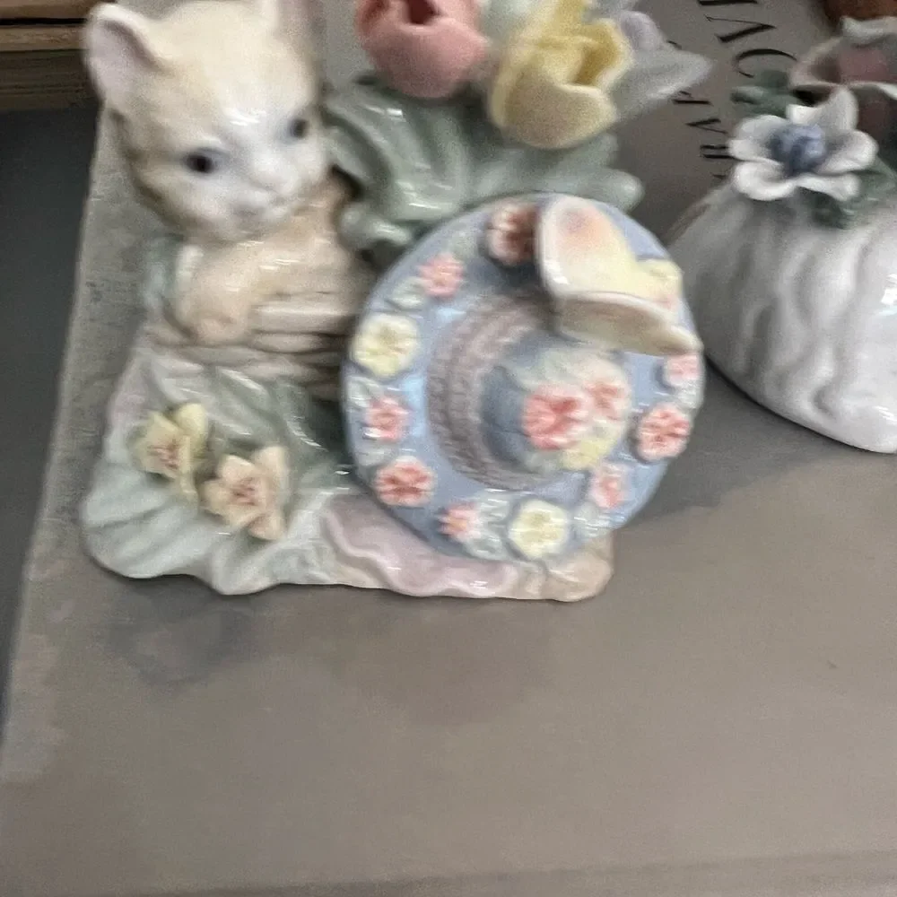 Set of two vintage small ceramic white and floral cats.